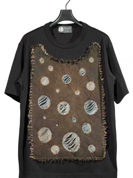 Acid dropped rounded shape on denim patchwork t-shirt