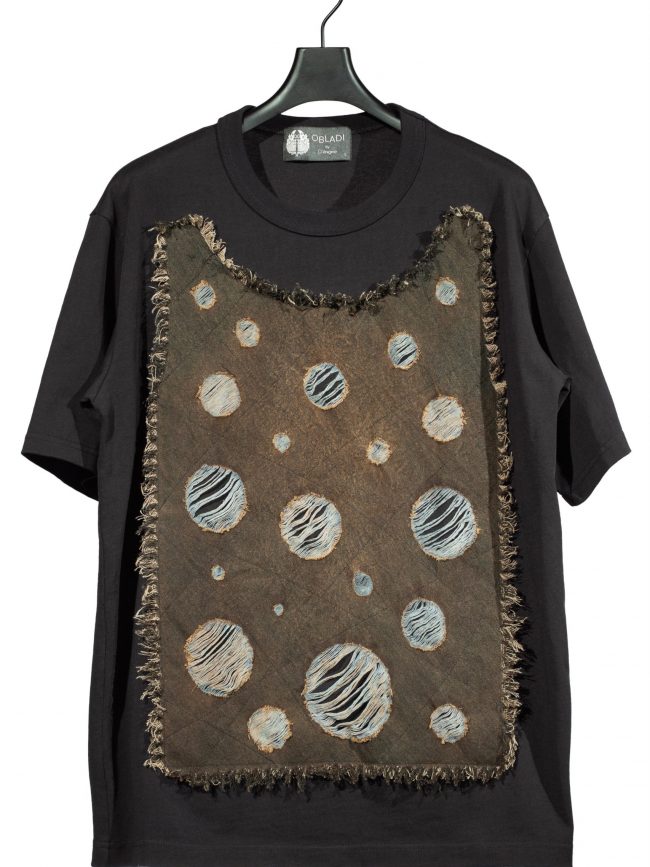 Acid dropped rounded shape on denim patchwork t-shirt