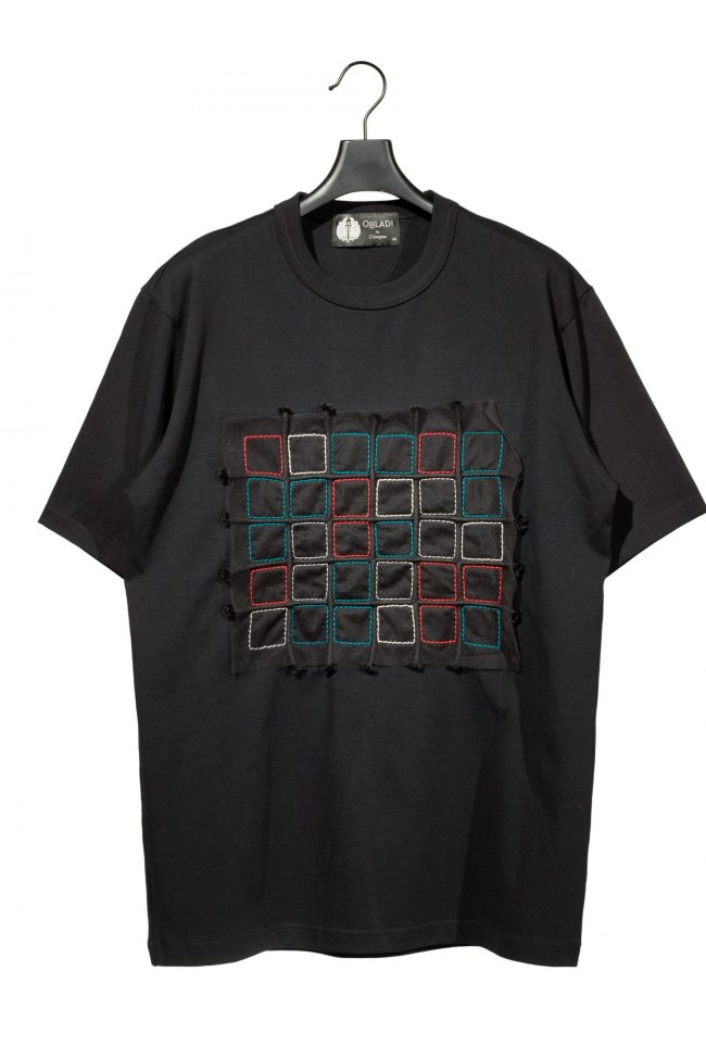 Black t-shirt with green-red crisscross square stitches on mesh